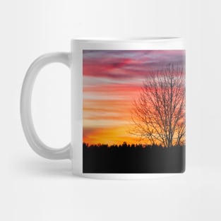 Tree silhouette and beautiful vibrant sunset clouds Mug